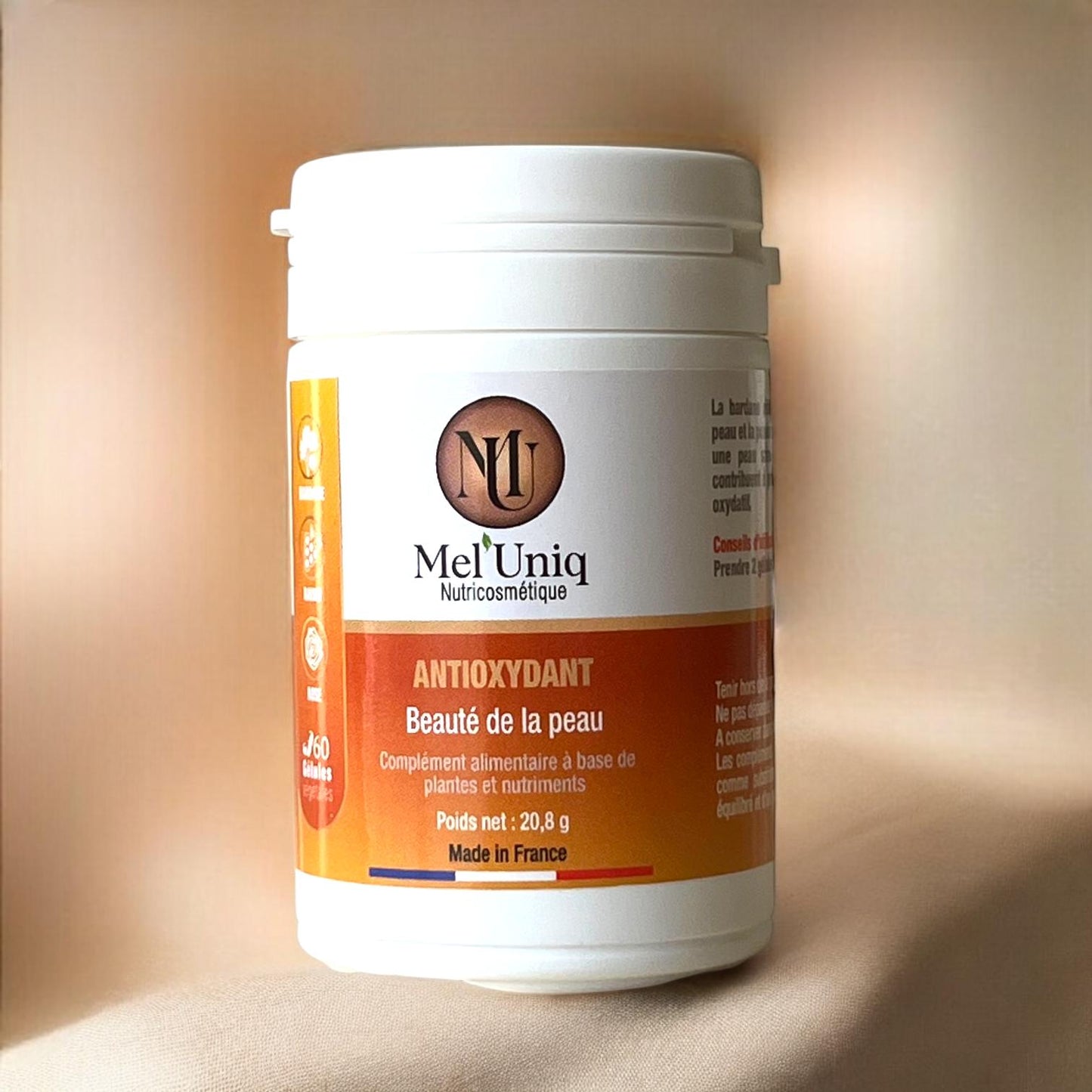 photo complément alimentaire antioxydant Mel'Uniq sur fond flouté